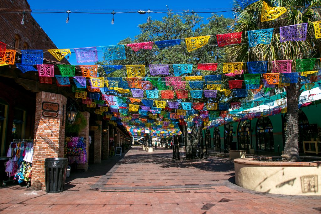 Colourful flags overhang historic Market Square, home to the landmark Mexican restaurant and bakery Mi Tierra.