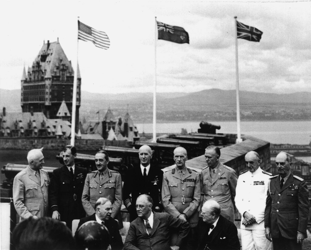 Mackenzie King, Franklin D. Roosevelt and Winston Churchill (front, left to right) with their generals and admirals at the first Quebec Conference at the Château Frontenac, August 1943.