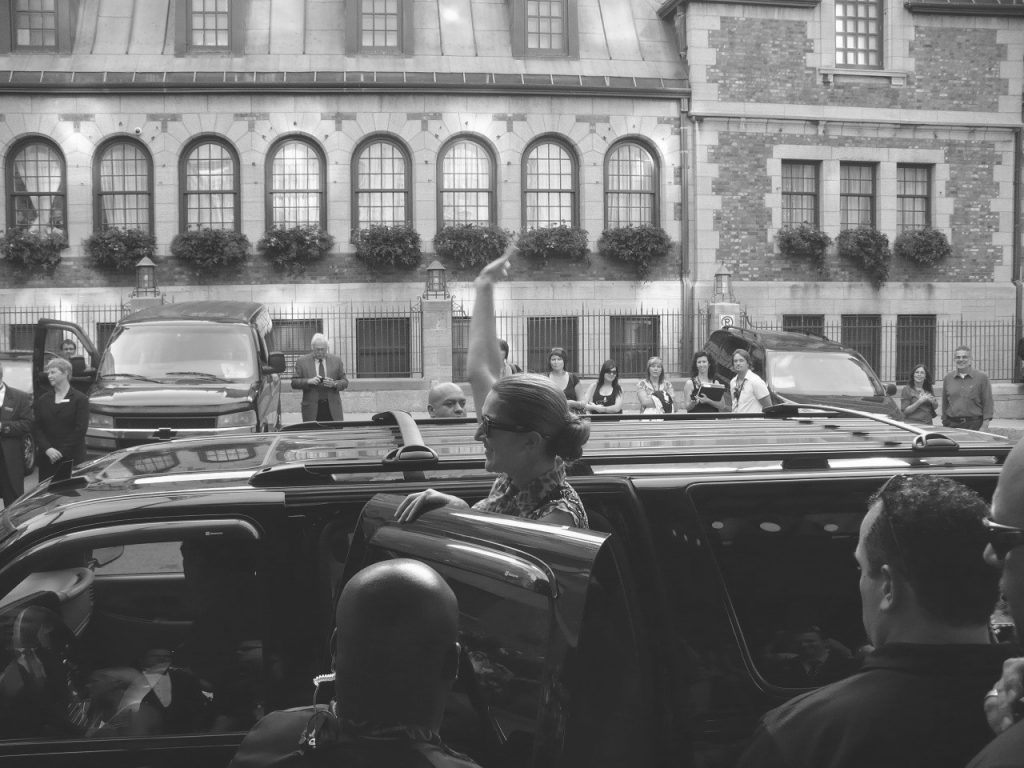 Céline Dion waves to fans outside the Château Frontenac.