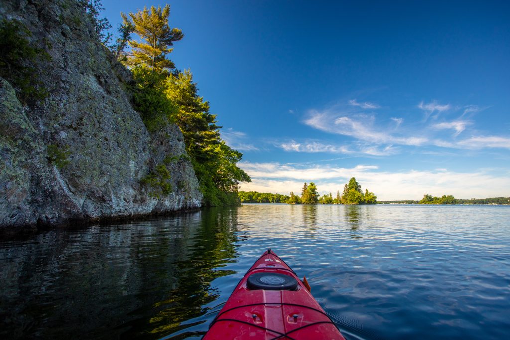 A red kayak in the St. Lawrence River