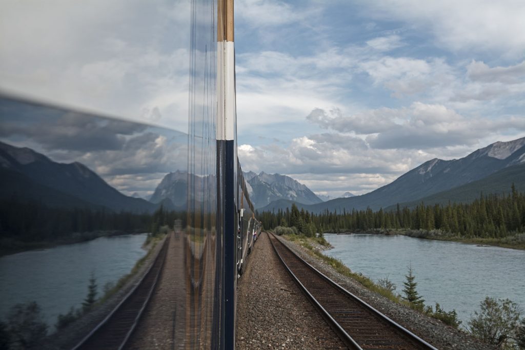 A river reflected in the train window